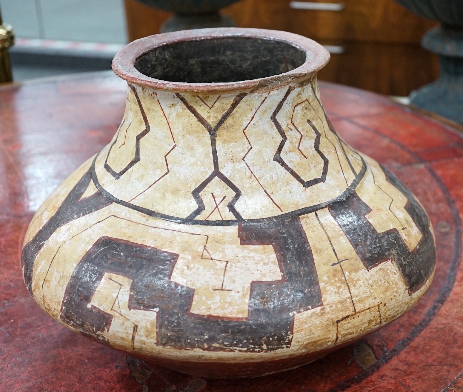 A Shipibo pottery water vessel with geometric pattern, Peru, 26cm tall